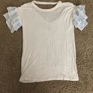 White blouse with blue patterned sleeve